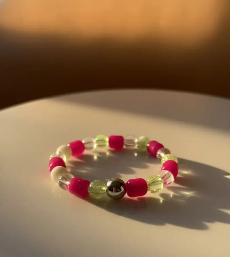 Bright Magenta, Lime Green, and Clear Quartz Energy Bracelet with a metallic center bead.