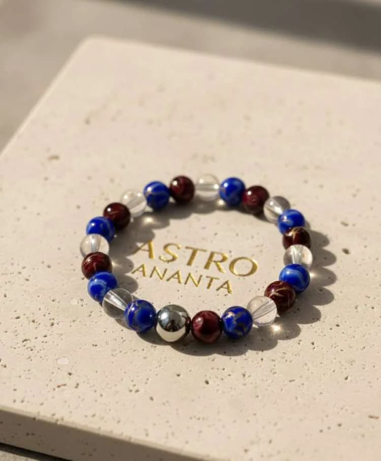 Lapis Lazuli, Garnet, and Clear Quartz Power Bracelet with a central metal bead.